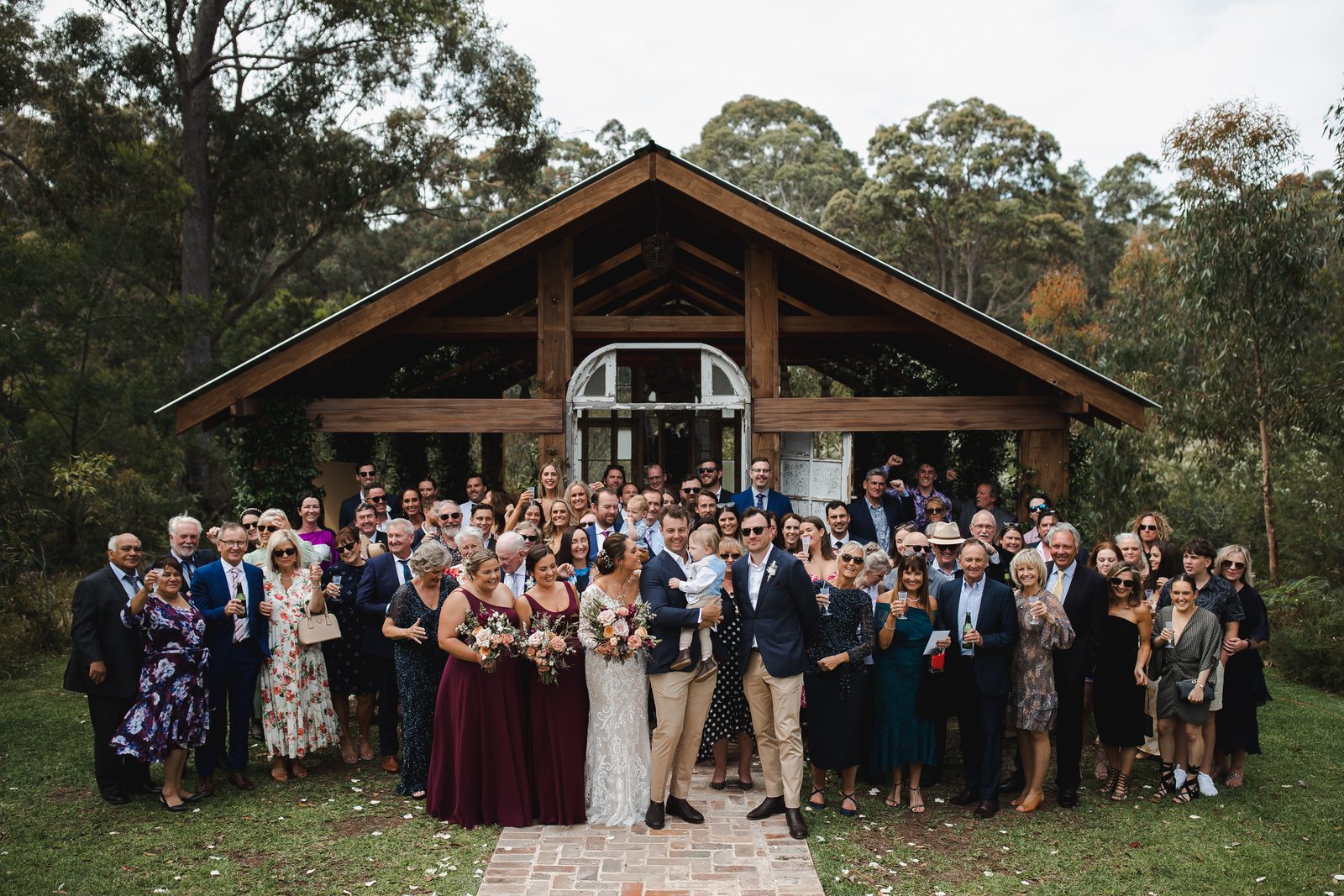 The whole wedding party gathered in front of the Bush Chapel
